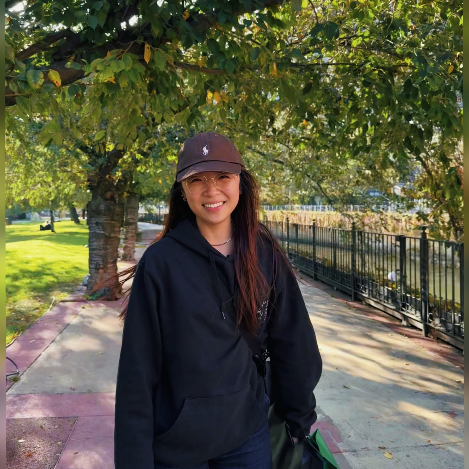 Tianyu smiling during a walk in the park